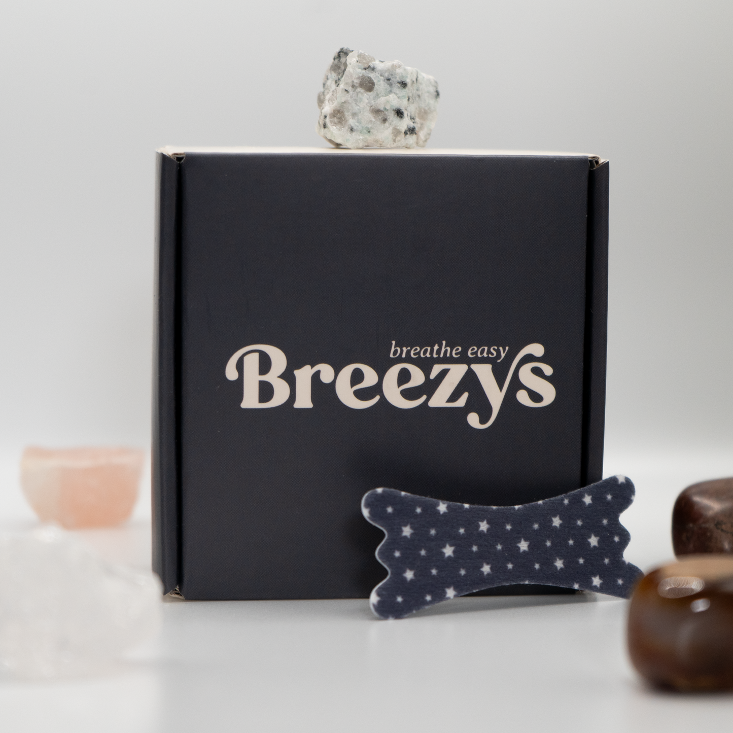 Starry Night Breezys Nasal Strips displayed against a white background surrounded by calming crystals.