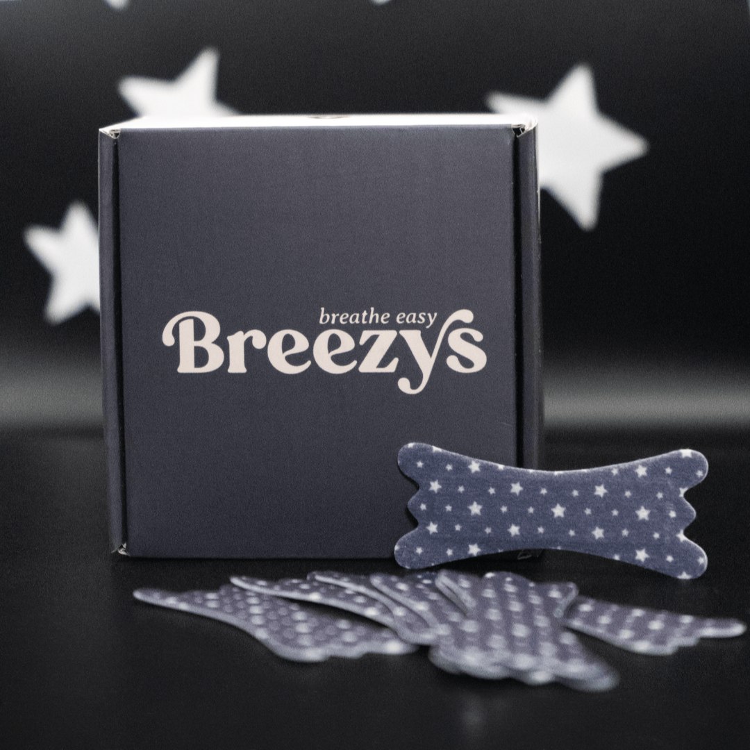 Starry Night Breezys Nasal Strips displayed against a dark background with white stars.