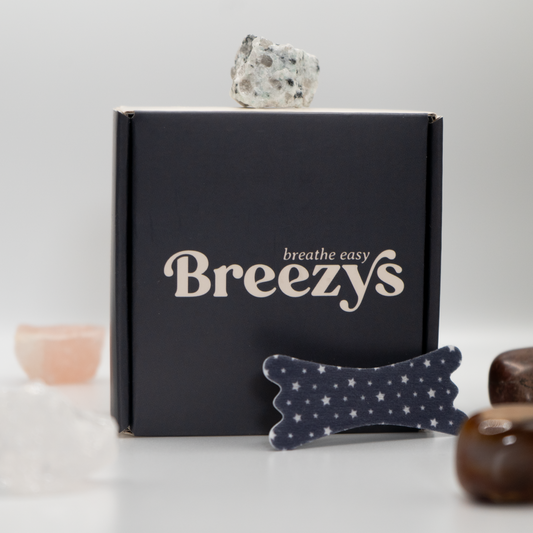 Starry Night Breezys Nasal Strips displayed against a white background surrounded by calming crystals.